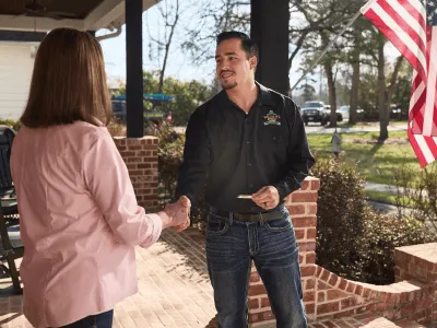 Wildlife removal specialist greeting customer